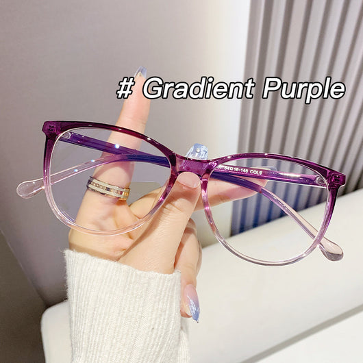 Black full-frame round anti-blue light glasses held by a hand with a gold ring and light blue gradient nails. - Image 9