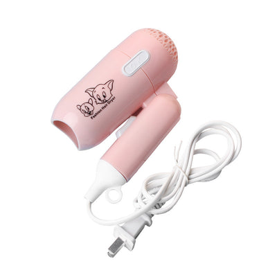 Light blue foldable hair dryer with a cartoon pig design, white power switch, and hanging loop. - Image 5