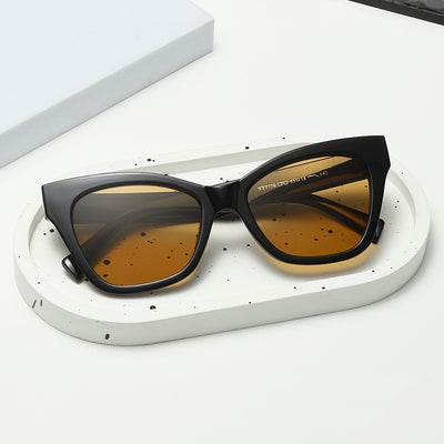 Fashion sunglasses with clear oval frames, dark gray lenses, and tortoise shell patterned temples. - Image 9