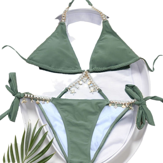 Olive green split bikini with gold chain and charm embellishments, worn with a sheer white cover-up on a beach. - Image 5
