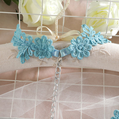 Light blue lace lingerie set with floral details, including a bra, thong, garter belt, choker, and leg chains. - Image 4