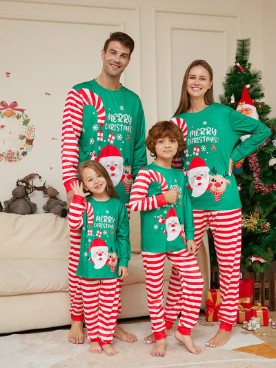 Family of four wearing matching green Christmas pajamas with Santa, reindeer, and red and white striped pants. - Image 16
