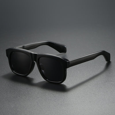 Black square-frame polarized sunglasses with dark lenses, suitable for both men and women, on a dark gray surface. - Image 6