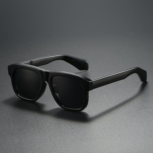 Black square-frame polarized sunglasses with dark lenses, suitable for both men and women, on a dark gray surface. - Image 6