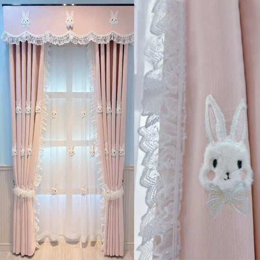 Pink curtains with white plush rabbit appliques, paired with a sheer white inner curtain also featuring rabbit designs.