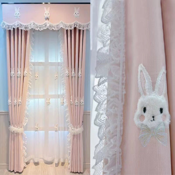 Pink curtains with white plush rabbit appliques, paired with a sheer white inner curtain also featuring rabbit designs.