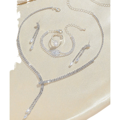 Sparkling rhinestone necklace, dangle earrings, and bracelet set on a black display, perfect for formal events. - Image 5