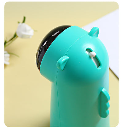 White automatic laser cat toy with a black dome projector and small cat ear details on top, featuring a green button. - Image 7