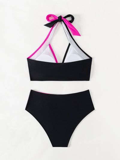 Black and white color-block halter bikini with high-waisted bottoms, modeled by a woman holding a straw hat. - Image 15