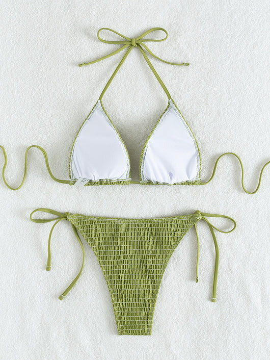 Women's lime green halter bikini with spaghetti straps and thong bottom, modeled outdoors against a blue sky. - Image 33