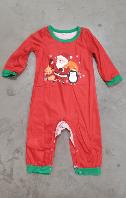 Family of five and pets wearing matching red and grey striped Christmas pajamas with Santa and penguin print. - Image 9