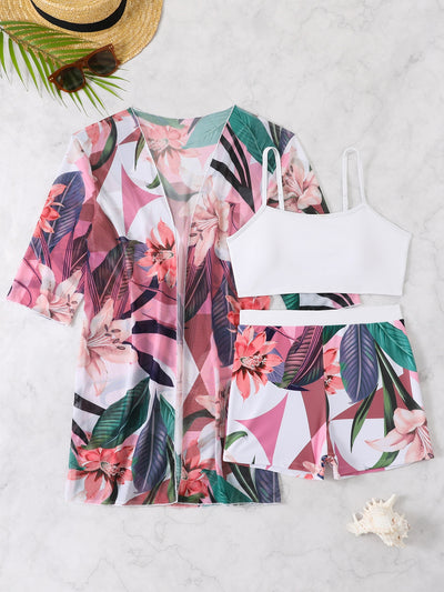 Woman in a three-piece bikini swimsuit set with a black tube top, floral boy shorts, and a sheer floral kimono cover-up. - Image 27