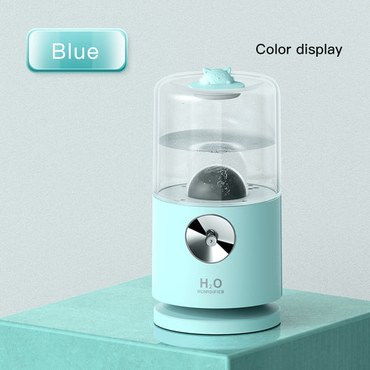 Light blue smart rotary projection humidifier with a clear water tank and a cute cat-shaped top. - Image 6