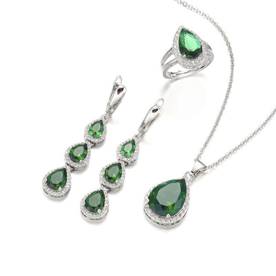 Green pear-shaped gemstone jewelry set with necklace, dangle earrings, ring, and bracelet, all with clear stone accents. - Image 11