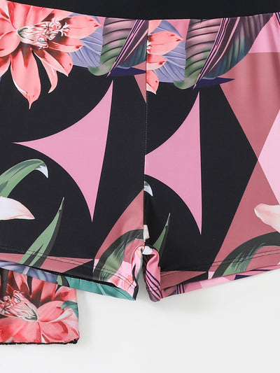 Woman in a three-piece bikini swimsuit set with a black tube top, floral boy shorts, and a sheer floral kimono cover-up. - Image 43
