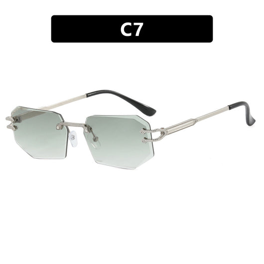 Rimless octagonal clear lens glasses with silver-toned metal temples and black ear tips, featuring decorative accents. - Image 6