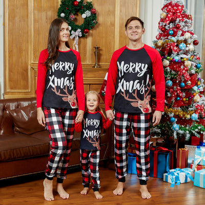 Black and red long-sleeve Christmas top with reindeer and "Merry Xmas!" text, paired with red, black, and white plaid pants.