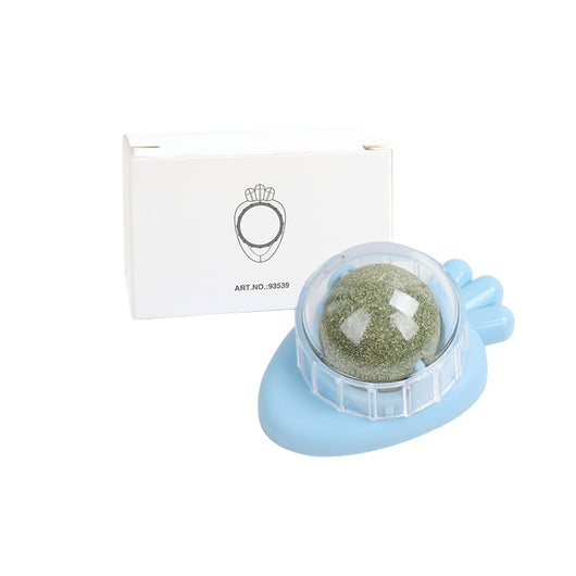 Orange carrot-shaped cat toy with a clear dome holding a rotating catnip ball, next to its white packaging box. - Image 14