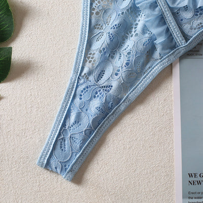 Light blue lace bralette and thong lingerie set with bow details and ruffle trim, displayed on a light surface. - Image 15