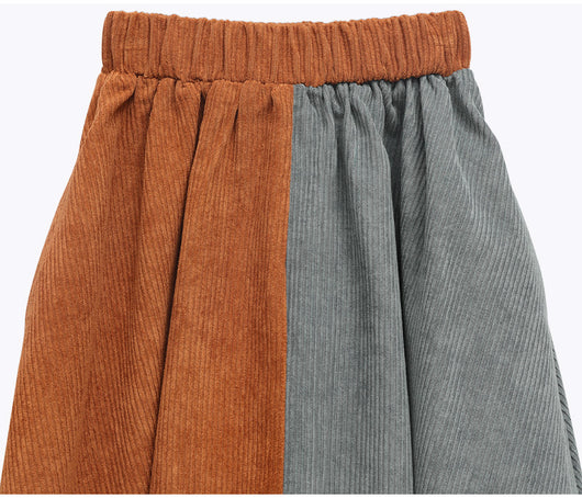 Young girl in a pink and brown color-block corduroy two-piece dress set with a collared top and midi skirt. - Image 14