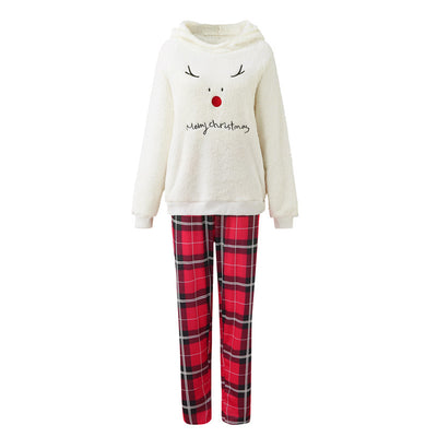 Family of four wearing matching cream fleece reindeer pajamas with red plaid pants, posing for a Christmas photo. - Image 17
