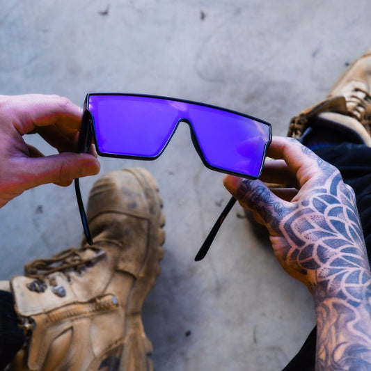 Black frame sports cycling sunglasses with vibrant purple polarized shield lenses, ideal for biking and outdoor activities. - Image 2