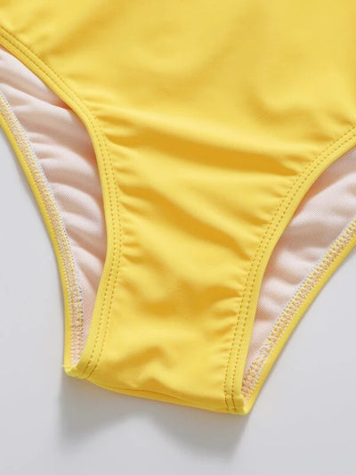 Vibrant orange strapless bandeau bikini top and high-waisted bottoms set, worn by a woman with a white shirt. - Image 27