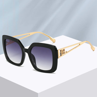Women's square fashion sunglasses with red and green gradient tortoise shell frames and gradient purple-to-yellow lenses.