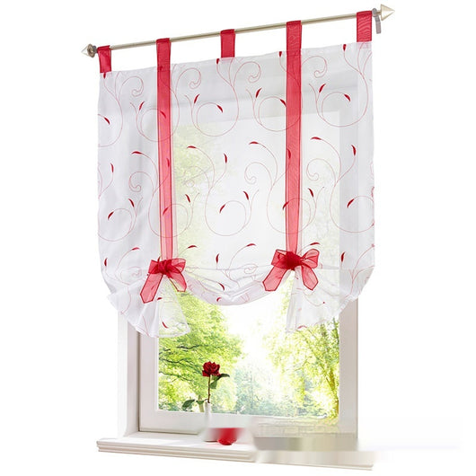 White sheer Roman window screen with red embroidered floral patterns and red ribbon ties, hanging from a silver rod. - Image 2