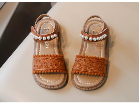 Children's white sandals with pearl ankle straps, woven front strap, and brown sole, featuring a Velcro closure. - Image 13