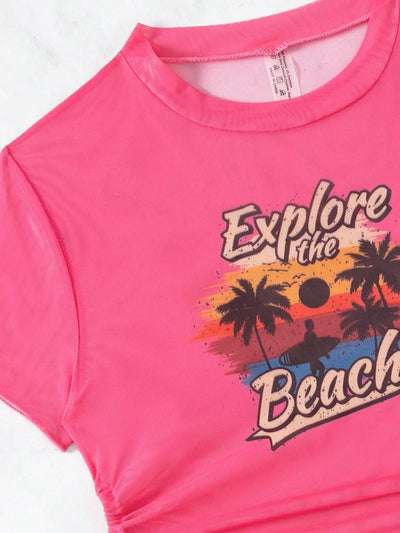 Black three-piece swimsuit with a mesh crop top featuring an "Explore the Beach" graphic, bikini top, and high-waisted bottoms. - Image 27