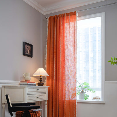 Black polyester curtain with white jacquard multi-line pattern and black tassels, draped over a white chair. - Image 18