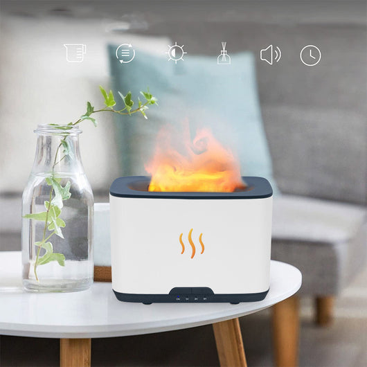 Dark gray rectangular aromatherapy humidifier with an orange flame-like mist and three essential oil bottles. - Image 3