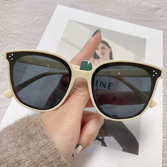 Cream square-style sunglasses with dark lenses, featuring small silver accents on the frame corners. - Image 2