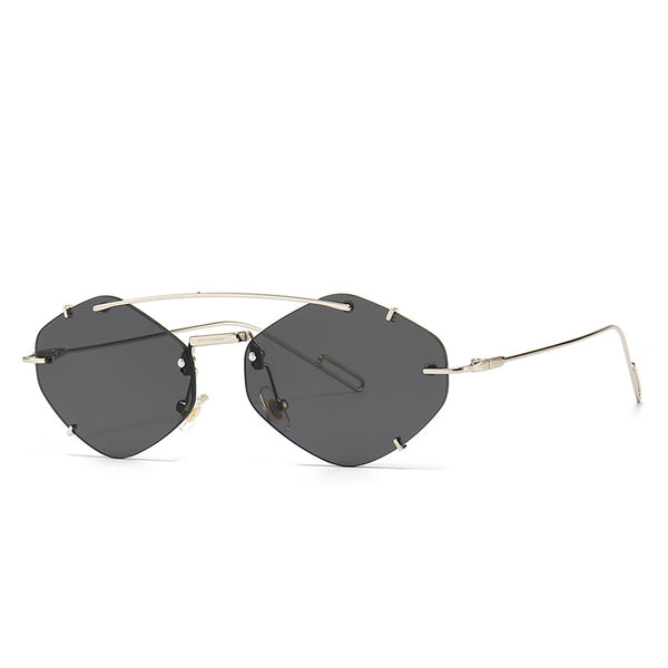Metal frameless sunglasses for women with geometric gradient gray lenses and a silver-colored frame. - Image 6
