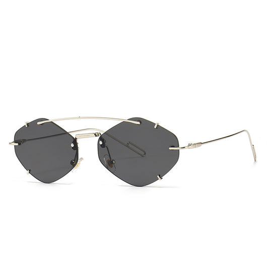 Metal frameless sunglasses for women with geometric gradient gray lenses and a silver-colored frame. - Image 6