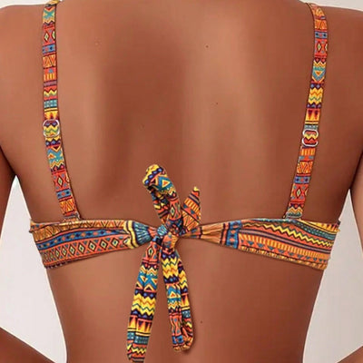 Blue, white, and black geometric print bikini with spaghetti strap bandeau top and high-waisted side-tie bottoms. - Image 4