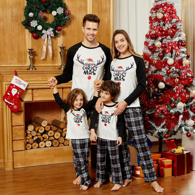 Christmas parent-child pajama set with a white and black raglan long-sleeved top featuring a 'Merry Christmas' reindeer graphic and red, black, and white plaid