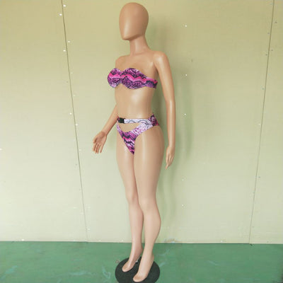 Woman in a purple and pink snakeskin print three-piece swimsuit with an off-shoulder crop top and high-waisted bottoms. - Image 13