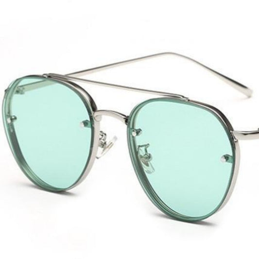 Pilot sunglasses for ladies with silver metal frames and light green gradient lenses, shown on a white background.