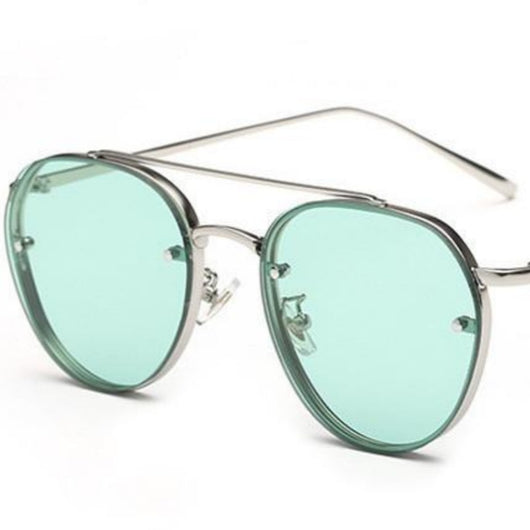 Pilot sunglasses for ladies with silver metal frames and light green gradient lenses, shown on a white background.