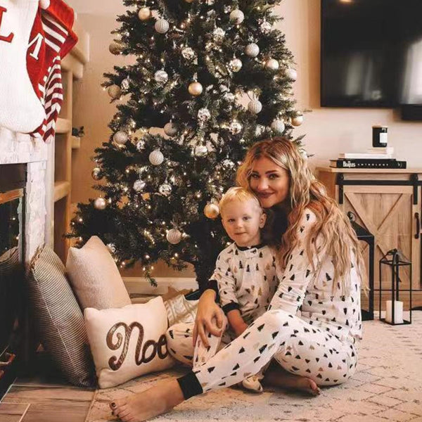White long-sleeve pajama set with black and brown Christmas tree print, featuring black cuffs and collar.