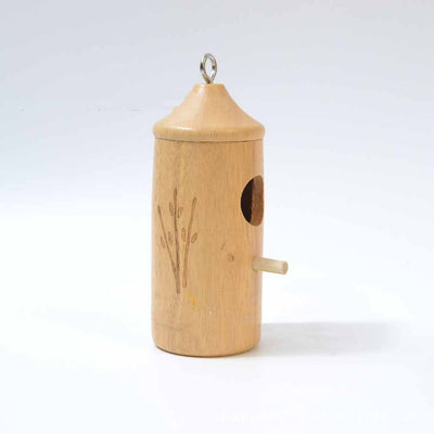 Light brown wooden birdhouse with a conical roof, circular entrance, perch, and etched branch design, hanging hook. - Image 7