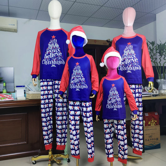 Family matching Christmas pajamas with blue long-sleeve tops, red raglan sleeves, and a Christmas tree graphic. Blue pants feature a white polar bear pattern. - Image 2