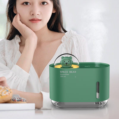 White square humidifier with a clear base, featuring a cute white bear figure in a clear dome, labeled "SPACE BEAR Humidifier 300 ml".