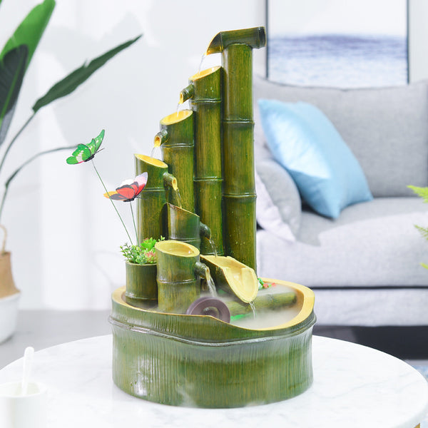 Green bamboo-themed indoor water fountain with multiple tiers, a water wheel, and small frog and butterfly accents.