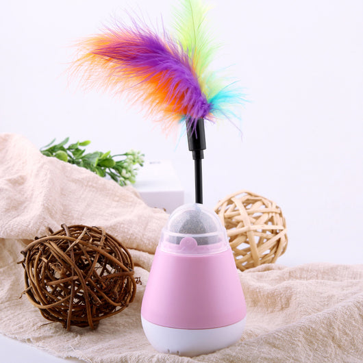 Pink and white tumbler cat toy with a clear dome revealing a catnip ball and a colorful feather wand. - Image 10