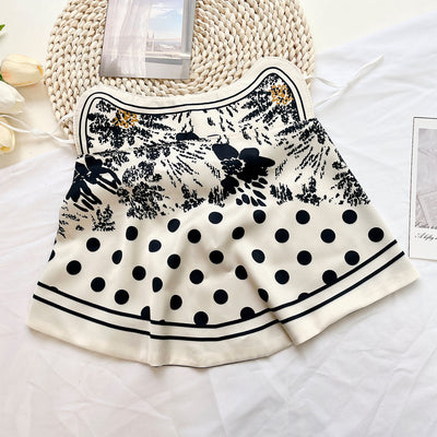 Female cream and black floral polka dot sun protection mask with ear loops, designed for eye corner protection. - Image 15