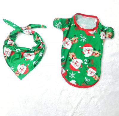 Family of four wearing matching green Christmas pajamas with Santa Claus and reindeer print, sitting on a sofa. - Image 16
