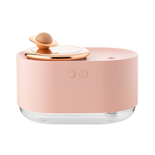 White USB rechargeable mini humidifier with a rose gold top accent and a wooden planet decoration. - Image 15